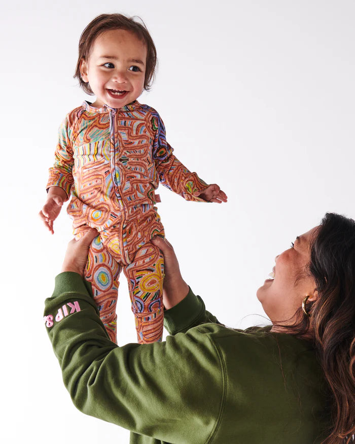 KIP & CO X ERNABELLA ARTS - NGAYUKU NGURA ORGANIC LONG SLEEVE ZIP ROMPER